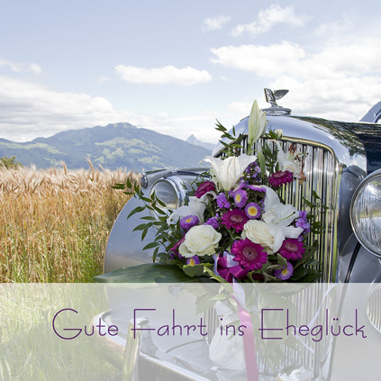 Oldtimer mit Blumenbouquet und Text "Gute fahrt ins Eheglück"